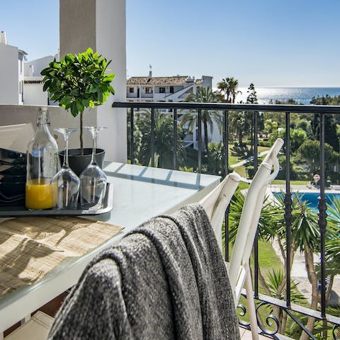 Enjoy breakfast on the balcony with a side of sea views
