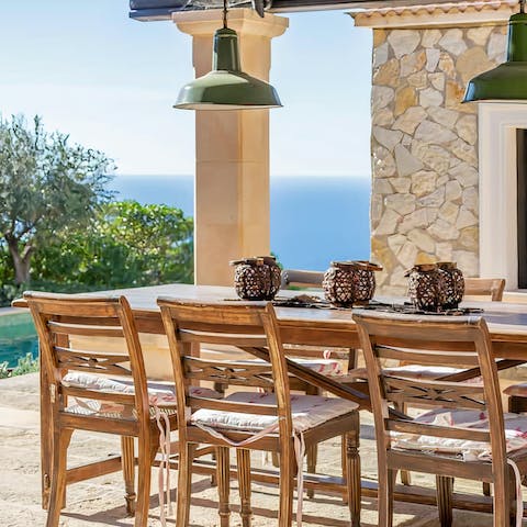 Dine al fresco with the view across the magnificent natural bay 