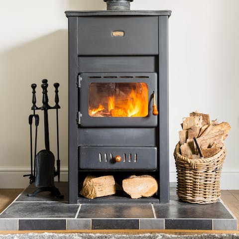 Get a fire roaring in the wood-burning stove and keep the bungalow cosy warm