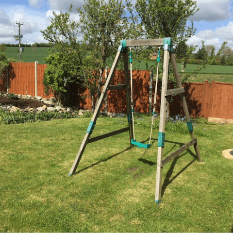Head out to the host's garden and play on the swing set