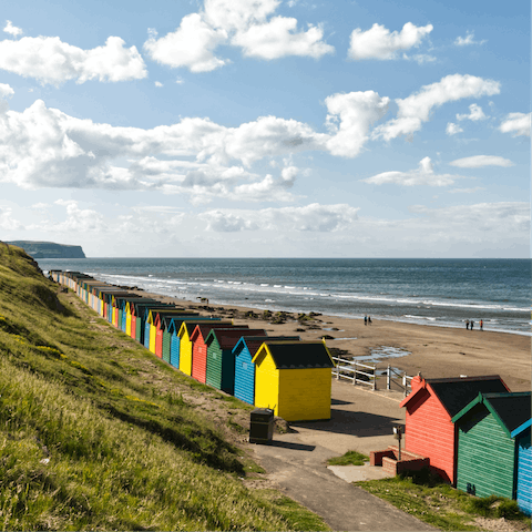 Sink your toes in the sand at Whitby Beach, a two-minute walk away