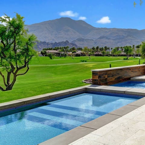 Float in the swimming pool with views of the Santa Rosa Mountains