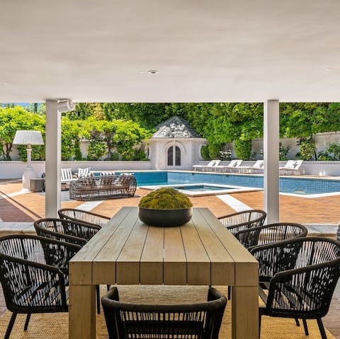 Dine alfresco on freshly-grilled burgers by the pool