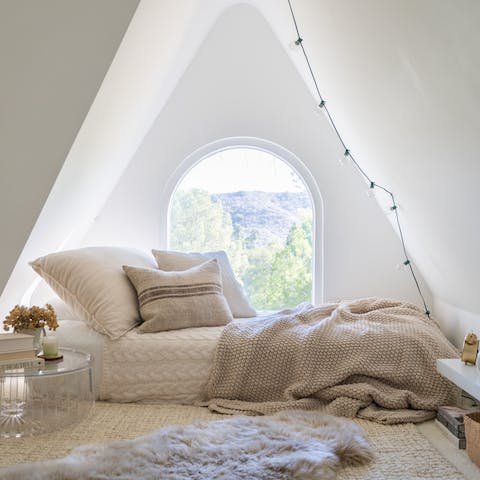 Sleep in the fairytale nook at the top of the house