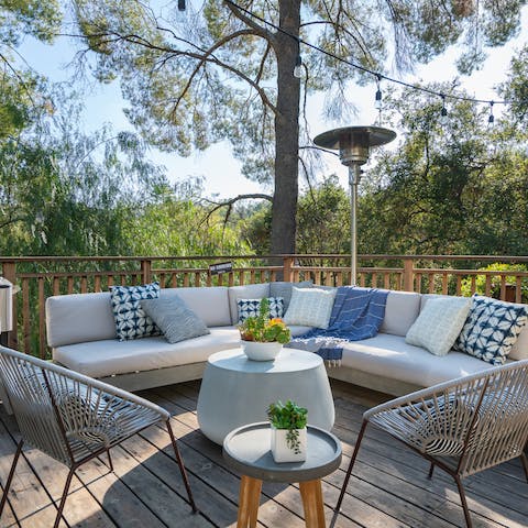 Sit out on the beautiful deck, surrounded by trees