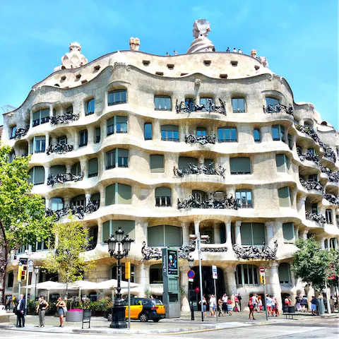 Admire Antoni Gaudí's eye-catching Casa Milà, within walking distance of your home