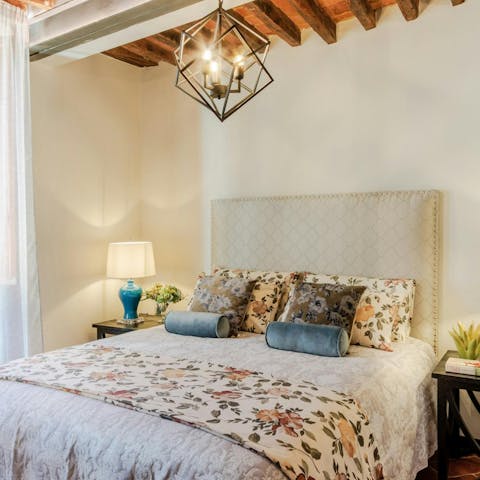 Relax in the comfy bedroom after a busy day in this Tuscan city