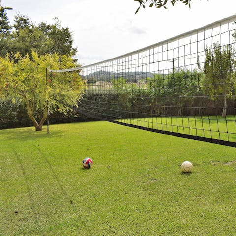 Play a few rounds of volleyball on your garden courts