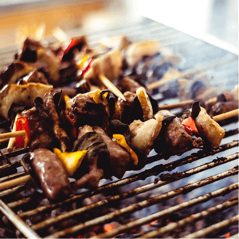 Cook a family feast on the home's stone barbecue