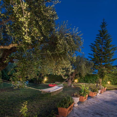 Fully relax in your huge private garden – beautifully lit at night