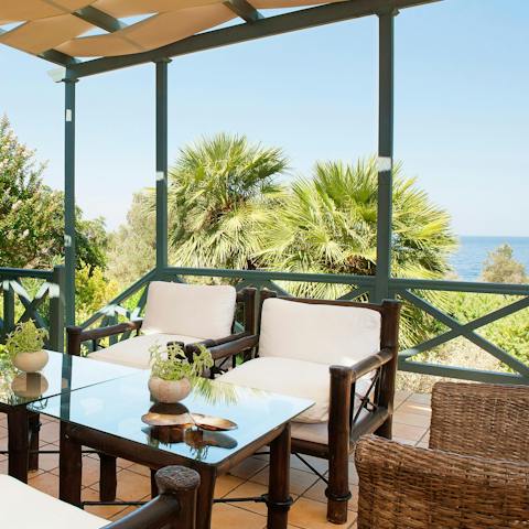 Savour your complimentary breakfast up on the private terrace, with sea views