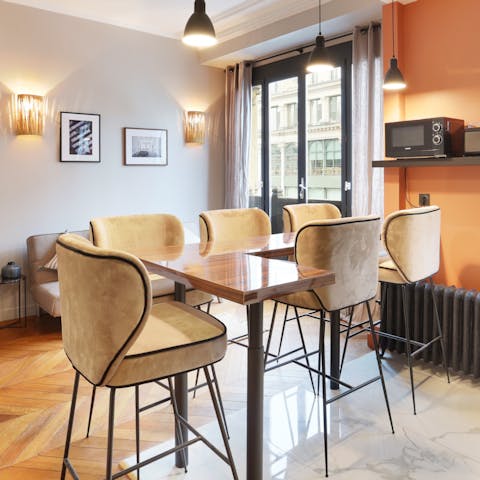 Gather around the chic dining table for morning coffees and late-night aperatifs