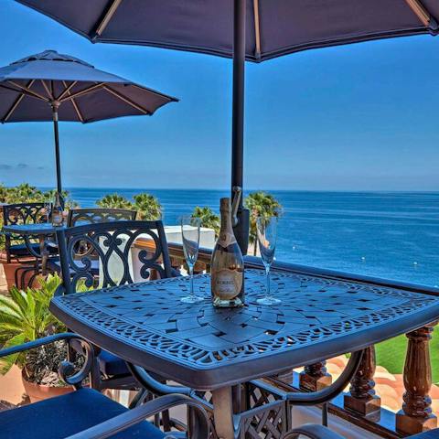 Enjoy drinks on the terrace overlooking the Pacific Ocean