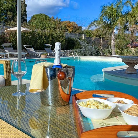 Sit by the pool and get the drinks flowing as you sun yourself on the poolside loungers