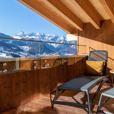 Take in the stunning mountain views from the balcony 