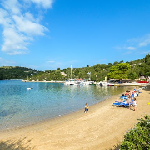 Spend a day on the golden sands of Mongonissi Beach