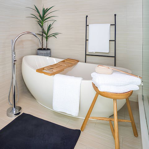 Take a relaxing soak in the master suite bathtub